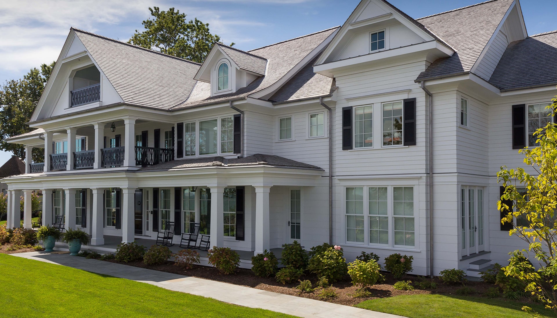 exterior of large home built by coastal luxury